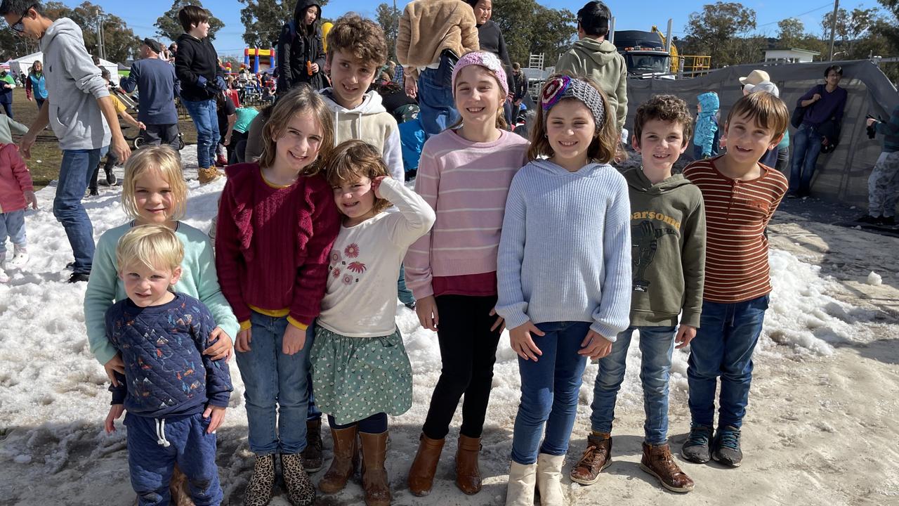 Cousins from Chambers Flat Isaac (2), Hailey (5), Emily (8), Isabella (4), Ryan (9), Ava (10), Sophia (8), Levi (5) and Luca Hendriksen (7) at the snowfields of the 2021 Snowflakes in Stanthorpe festival. Photo: Madison Mifsud-Ure / Stanthorpe Border Post