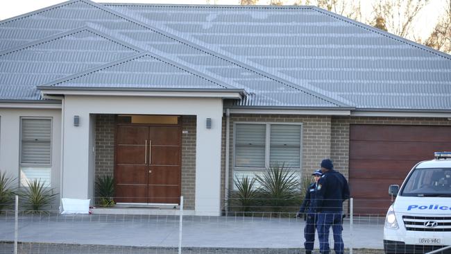 Police outside a home in Bringelly after an alleged home invasion. Picture: John Grainger