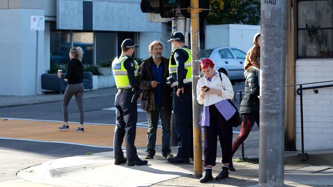 Senior Constable Greg Browne and Constable Thomas Nagle making sure pedestrians are obeying street signs and traffic symbols as part of a police operation targeting major intersections across Melbourne’s northern suburbs. Picture: Mark Dadswell