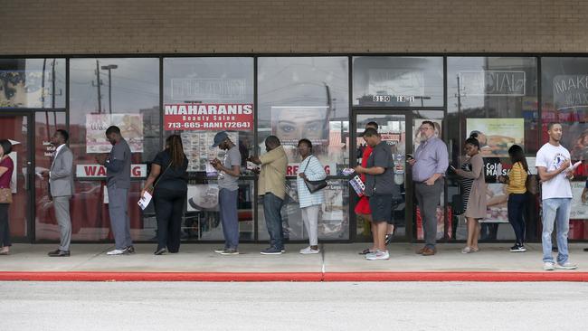 Voters wait in the line to vote at the Fiesta Mart in Houston. Picture: AP