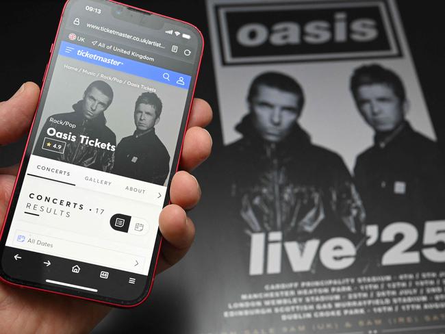 A fan uses a smart phone to access online ticket sales in the UK. Picture: Oli Scarff/AFP