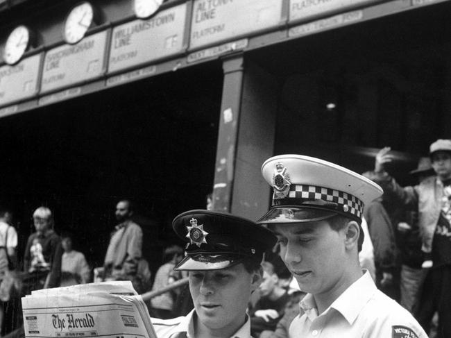 Two police officers outside Flinders St Station in 1990.