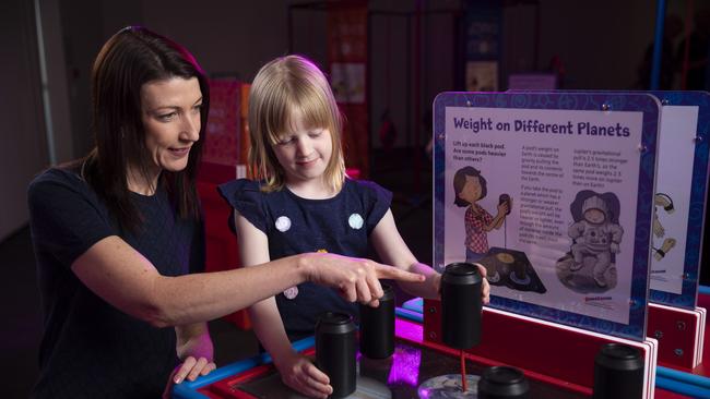 Kristy Hayes and her daughter Zoe Hayes check out the Science on the Move exhibit.