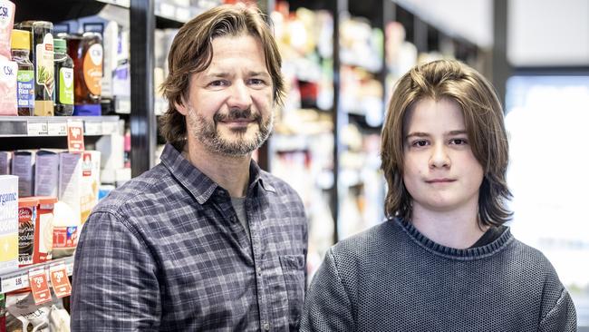 Hill Street Sandy Bay shoppers, Lenny and Luka Bartulin are interviewed about Check In Tas app changes. Picture Eddie Safarik