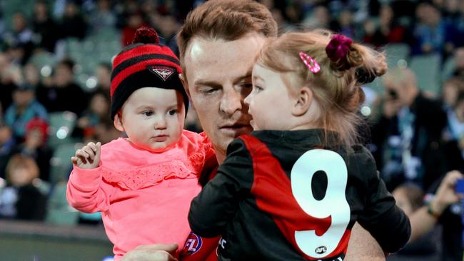 Brendon Goddard runs out for his final match with his kids.