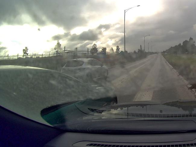 Ager’s car is seen mounting the grass to overtake two vehicle before he accelerates to 120km/h. Picture: Supplied.