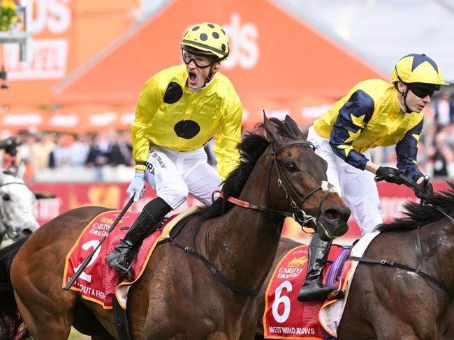 MELBOURNE, AUSTRALIA - OCTOBER 21: Mark Zahra riding Without A Fight defeats Jamie Spencer riding West Wind Blows abd Ben Melham riding Gold Trip in Race 9, the Carlton Draught Caulfield Cup, during Melbourne Racing at Caulfield Racecourse on October 21, 2023 in Melbourne, Australia. (Photo by Vince Caligiuri/Getty Images)