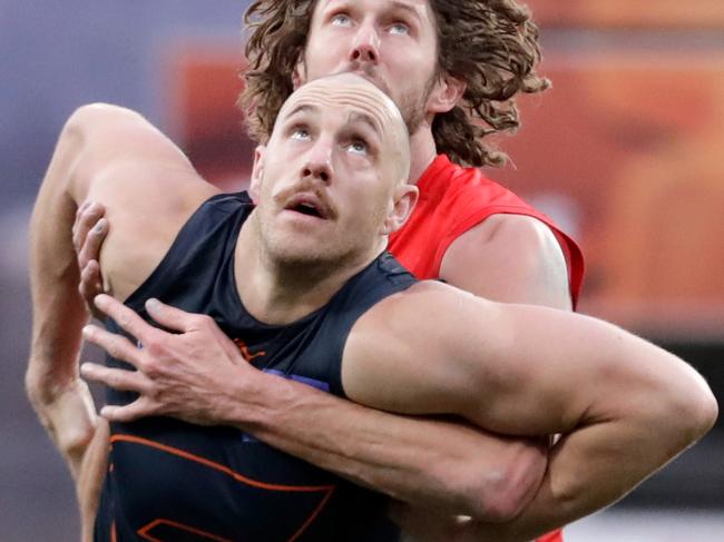 LAUNCESTON, AUSTRALIA - AUGUST 28: Shane Mumford of the Giants and Tom Hickey of the Swans compete in a ruck contest during the 2021 AFL Second Elimination Final match between the Sydney Swans and the GWS Giants at University of Tasmania Stadium on August 28, 2021 in Launceston, Australia. (Photo by Grant Viney/AFL Photos via Getty Images)