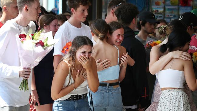 Friends of Jack Beasley gather to pay their respects at the scene of the tragedy outside the Surfers Paradise IGA. Photographer: Liam Kidston.