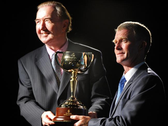 Trainer Dermot Weld and jockey Michael Kinane hold the 2010 Melbourne Cup.