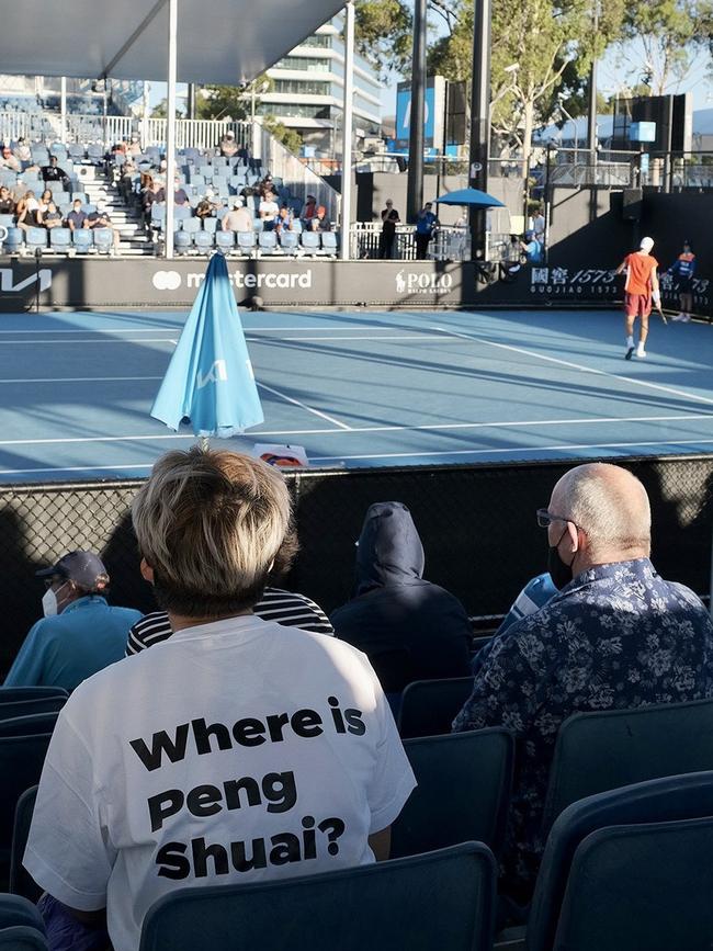 A protester wears a T-shirt supporting missing Chinese tennis star Peng Shuai at the Australian Open.