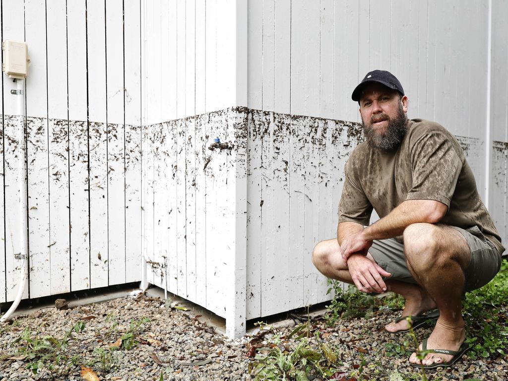 David Napier pictured at his home showing the flood level on Edmonstone street in Newmarket after TC Alfred. Picture: Josh Woning