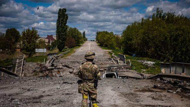 A soldier of the Kraken Ukrainian special forces on the road near the village of Rus'ka Lozova, north of Kharkiv. Picture: AFP.