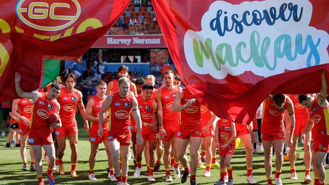 The Gold Coast Suns enter the field. (Photo by Russell Freeman/AFL Photos via Getty Images)