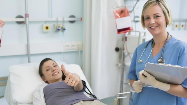 Nurse next to a patient while holding a clipboard in hospital ward Learn Poster. Blood donation. June 16.