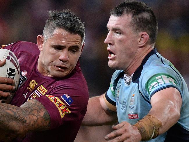 BRISBANE, AUSTRALIA - JULY 09: Corey Parker of the Maroons takes on the defence during game three of the State of Origin series between the Queensland Maroons and the New South Wales Blues at Suncorp Stadium on July 9, 2014 in Brisbane, Australia. (Photo by Bradley Kanaris/Getty Images)