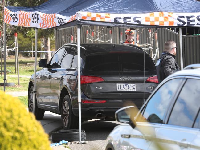 Police with the dumped Audi Q5. Picture: David Crosling