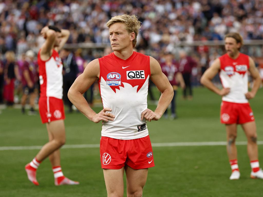 Cheer, cheer the red and the white? Edwina Bartholomew is conflicted about Aussie sports such as the AFL (pictured are the Sydney Swans during their Grand Final loss at the MCG in September). Picture: Phil Hillyard