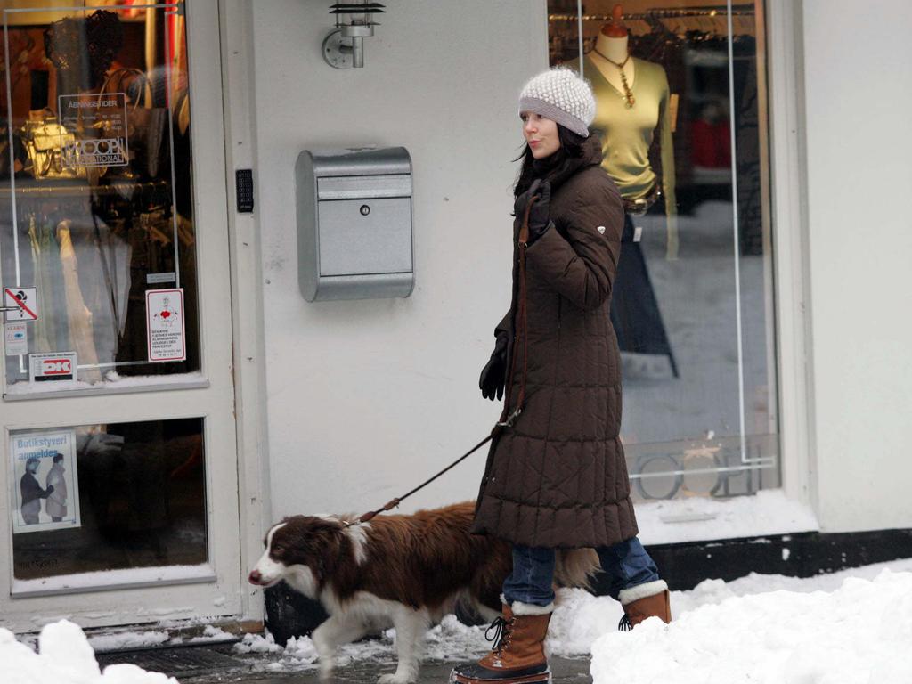 The then Crown Princess Mary of Denmark walks her dog Ziggy in Fredensborg village in Copenhagen in 2006. Picture: Tim Anderson.