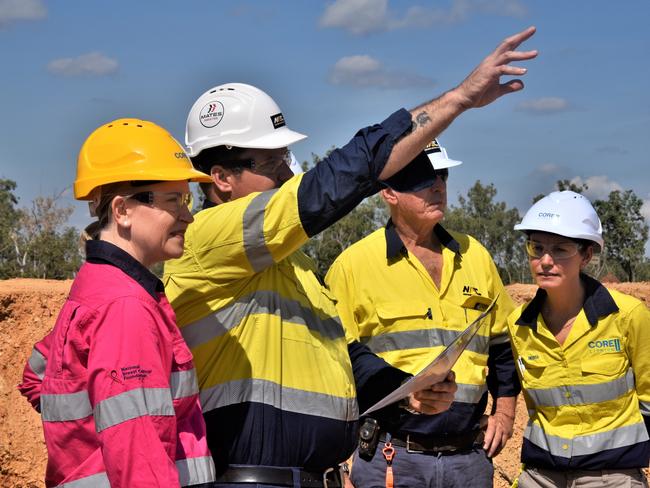 Mining Mining Minister Nicole Manison is shown the BP33 plans by Northern Australia Civil Managing Director Jimmy Riggall, Robert Wilson OAM, and Core Lithium Executive General Manager, Sustainability Melissa Winks. Picture: Fia Walsh