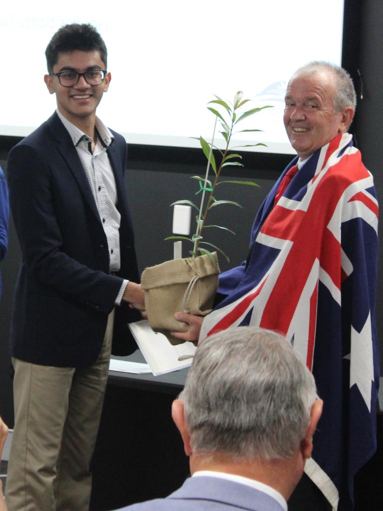 Councillor Vince Habermann was draped in the Australian flag as he congratulated the new citizens recognised at the 2024 Australian Citizenship Ceremony.