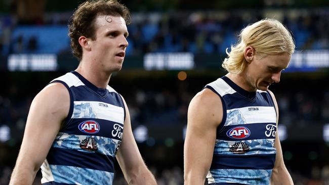 MELBOURNE, AUSTRALIA - APRIL 27: Max Holmes (left) and Oliver Dempsey of the Cats look dejected after a loss during the 2025 AFL Round 07 match between the Carlton Blues and the Geelong Cats at the Melbourne Cricket Ground on April 27, 2025 in Melbourne, Australia. (Photo by Michael Willson/AFL Photos via Getty Images)
