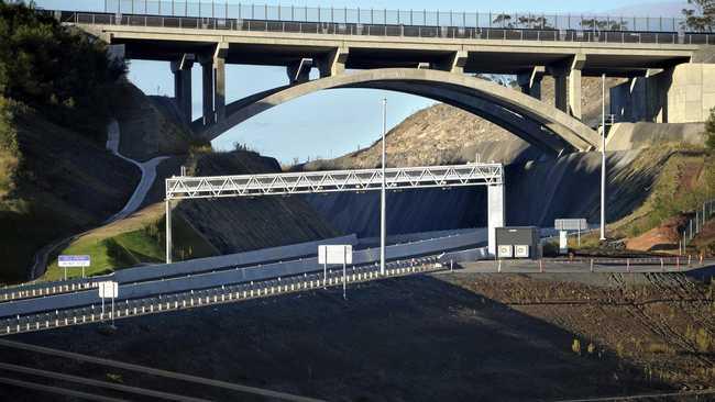 DRIVING TOLL: A toll point and signs for toll payment provider Linkt can be seen on an under-development section of the Toowoomba Second Range Crossing. Picture: Kevin Farmer