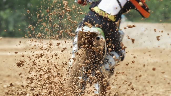 General, generic stock photo of mud debris flying from a rear tyre of a trail bike during a motocross dirt bike race. Photo: iStock - Getty Images.