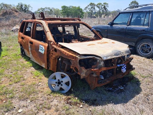 Unregistered, burnt out, five door Nissan Xtrail wagon.