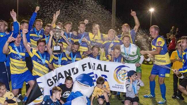 Broadbeach United players, officials and supporters in full cry after the breathtaking grand final win. Photo: Jerad Williams