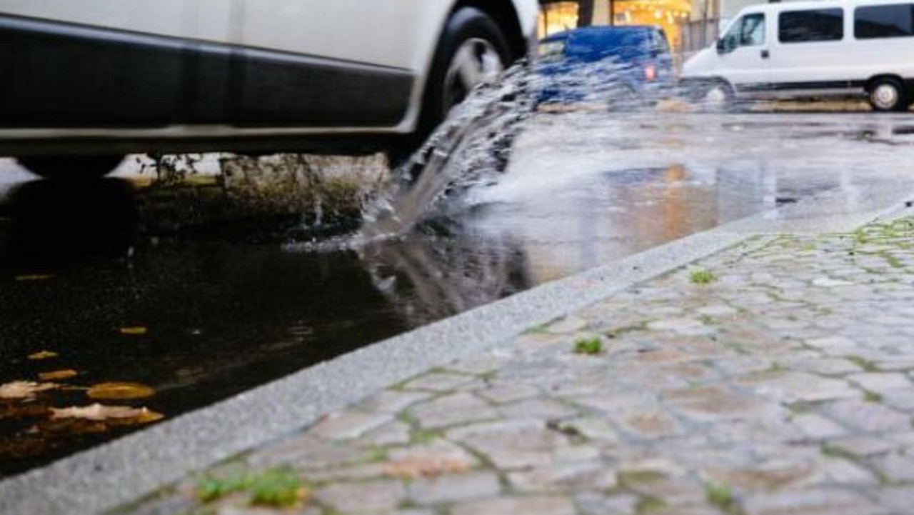 Have you ever been splashed by drivers on a rainy day? That’s another traffic offence. Picture: Escape