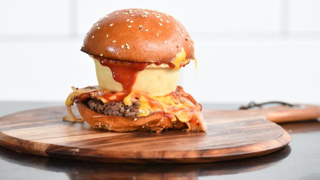 How Aussie is this? Suburban Burger in Lynbrook created a meat pie in a burger for Australia Day. Picture: Jason Sammon.