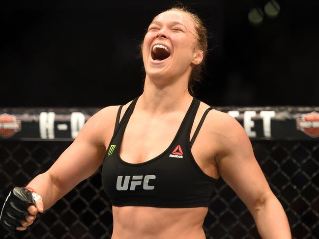 LOS ANGELES, CA - FEBRUARY 28: Ronda Rousey celebrates her victory over Cat Zingano in their UFC women's bantamweight championship bout during the UFC 184 event at Staples Center on February 28, 2015 in Los Angeles, California. (Photo by Harry How/Getty Images)