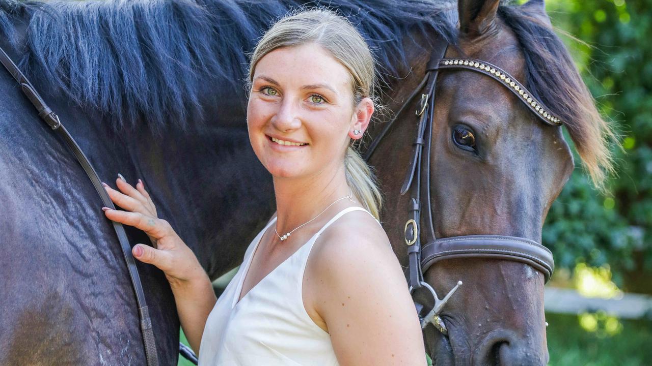 Jamie Kah and her favourite horse, Brax, one of the retired racehorses on her farm. Picture: Nicole Cleary