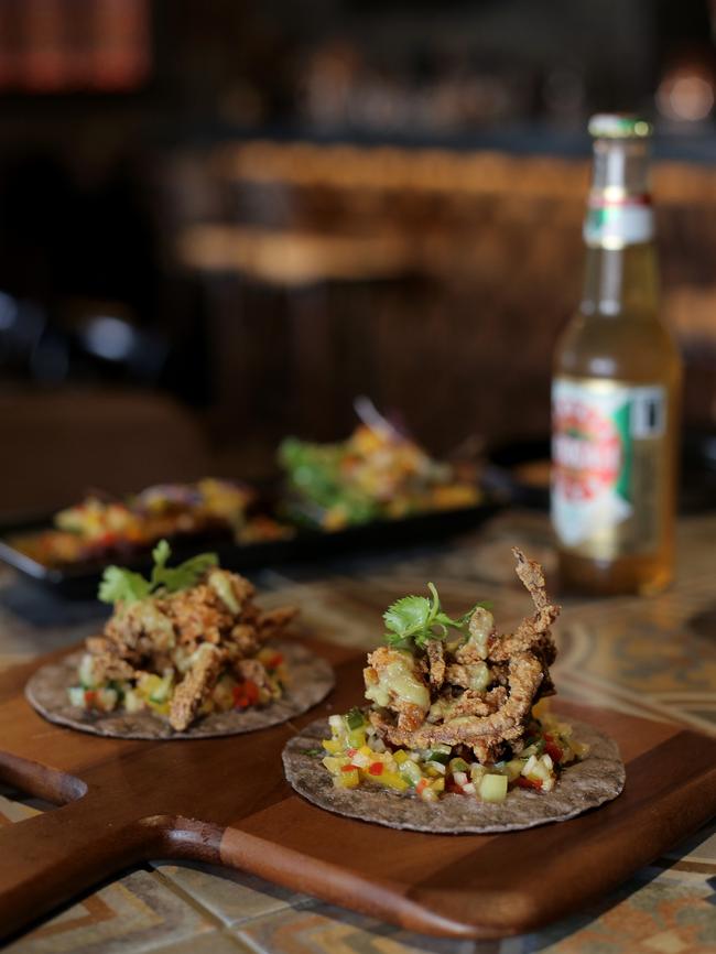 Blue corn taco with spicy soft shell crab al pastor with pico de gallo, jicama and pineapple.