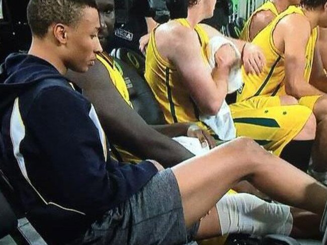 Exum rests his knee after injuring it playing for the Boomers against Slovenia.
