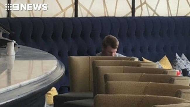 David Warner sits alone at the Australian team's Cape Town hotel.
