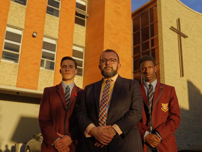 Catholic school funding. A group of students with the Principal Marco DiCesare upset about funding being cut to catholic schools. Photographed with students James (y12) and Panesh (y11).  Picture: Valeriu Campan