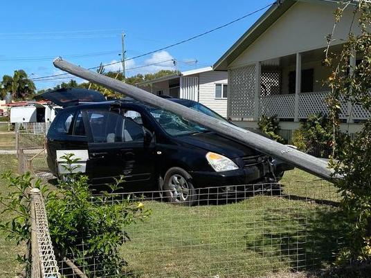 A car has collided with a power line in Bowen, uprooting it from the ground. Photo: Lesley Yasso