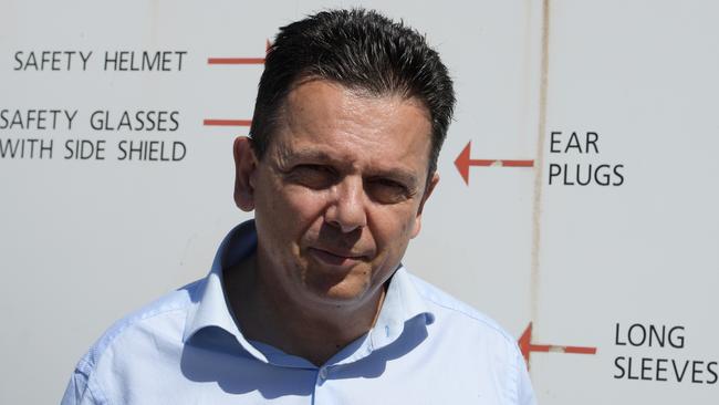 SA Best Leader Nick Xenophon in front of a safety sign at the Port Stanvac Refinery.  Picture: AAP / Tracey Nearmy