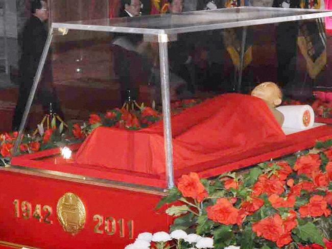 The body of North Korean leader Kim Jong Il lies in state in a glass coffin at the Kumsusan Memorial Palace in Pyongyang on December 20, 2011.