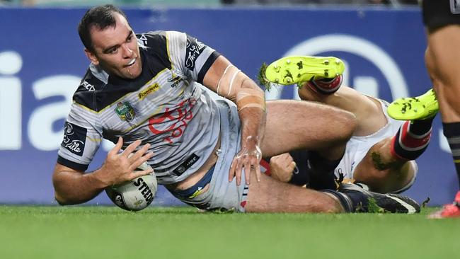 Kane Linnett crosses over for the Cowboys. (AAP Image/David Moir)