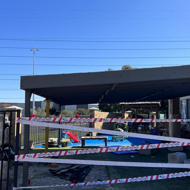 Firefighters and police work to investigate and clear the scene where a car drove through a playground at an early learning centre in Sunshine West. Picture: Fergus Ellis.