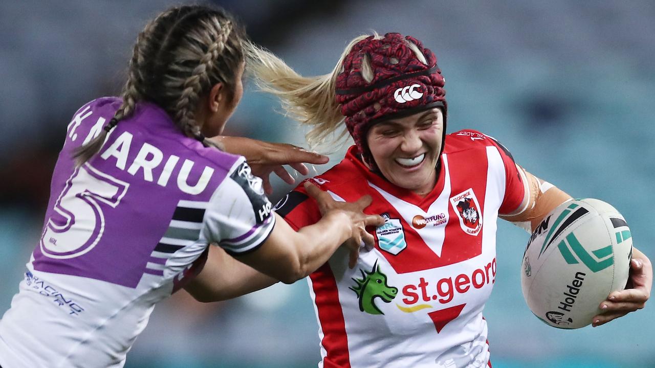 Julia Robinson of the Broncos (right) is tackled by Ruan Sims of the  Roosters during the