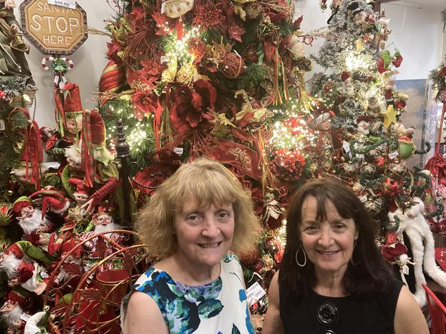 Sisters Connie and Mel in their Christmas shop Ambiance which has been open at the Queen Vic Market for 23 years.