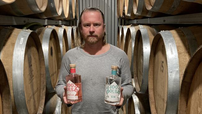 Head distiller Anton Balog holding the new handcrafted 100 Souls gin range.