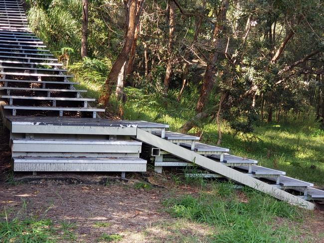 The stairs descending from the bottom of Ross St to the waterfront dinghy rack and the boardwalk heading east to Glades Bay Reserve.