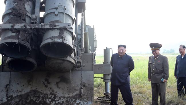 Kim Jong-un at the testing of a multiple rocket launcher last week. Picture: AFP