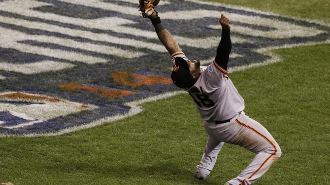 Pablo Sandoval catches the last out to secure the World Series.