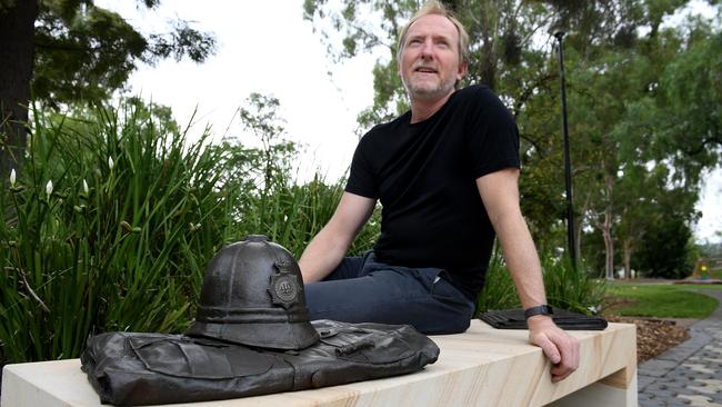 Artist Karl Meyer and his memorial to Constable William Hyde. Picture: Mark Brake